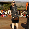 Madonna plants a tree during a visit to Malawi