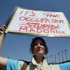 A woman protests against Madonna's visit