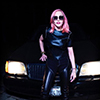 Madonna with pink hair, posing posing in a Mercedes Benz.