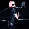 Madonna with pink hair, posing posing in a Mercedes Benz.