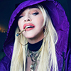 Madonna in a purple Prada outfit. Photo by Ricardo Gomes.