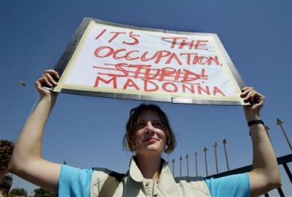 A woman protests against Madonna's visit