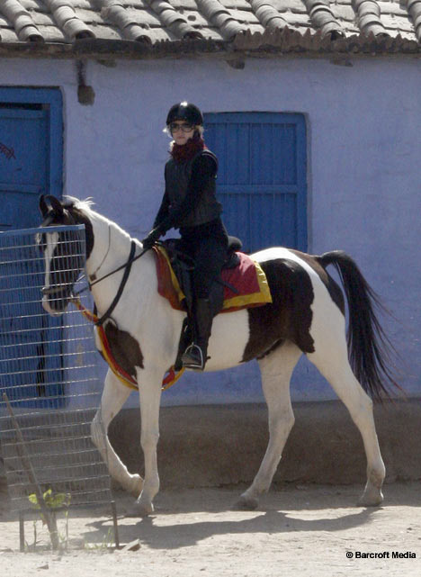 Madonna riding horse in India