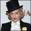Feminine touch: Madonna topped off her otherwise entirely masculine look with lashings of blood red lipstick