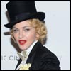 Feminine touch: Madonna topped off her otherwise entirely masculine look with lashings of blood red lipstick