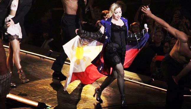 Madonna always wears the flag of the country she visits during her encore Holiday