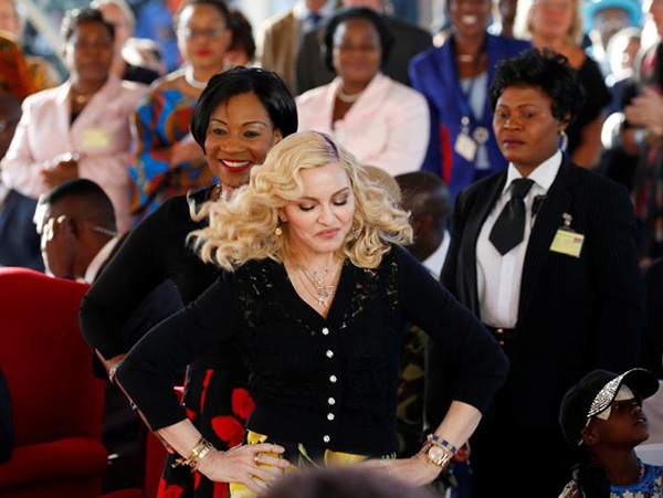 Madonna dances at the opening of the Mercy James Center in Malawi