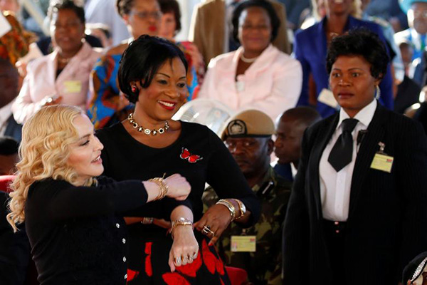 Madonna dances at the opening of the Mercy James Center in Malawi