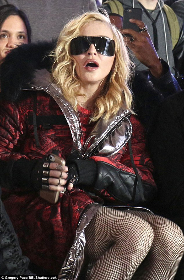 Overwhelmed: Madonna was open mouthed as she watched the presentation of Phillipp Plein