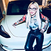 Madonna posing with her car