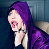 Madonna in a purple Prada outfit. Photo by Ricardo Gomes.